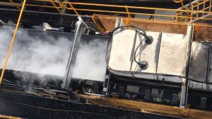 Dry fog dust control solution on a conveyor