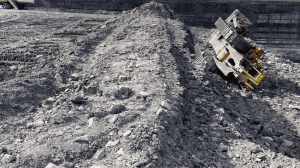 A dozer tipped over incident while levelling windrow
